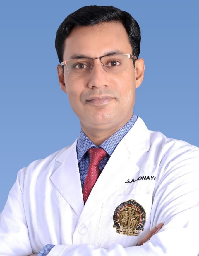 Dr. Sharif Ahmed Jonayed, spine surgeon, in a white coat at NITOR, Dhaka